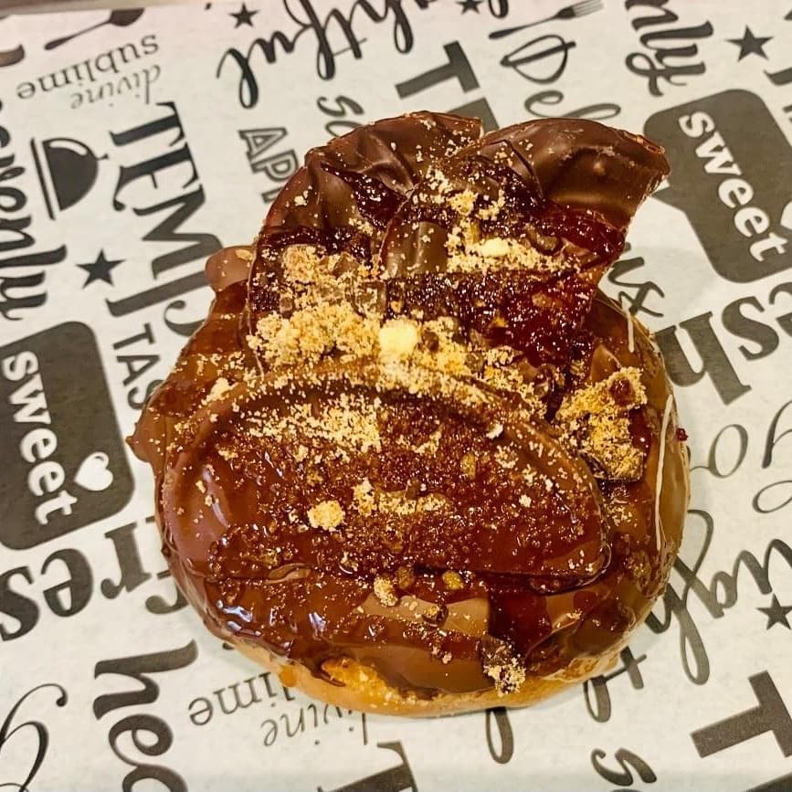 Chocolate cruffin on branded paper