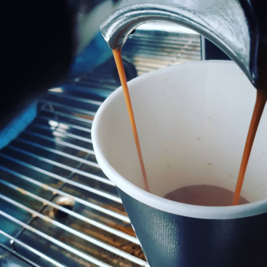 Espresso being pulled into a cup on the van